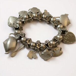 Silver Charm Bracelet with Floral Accents